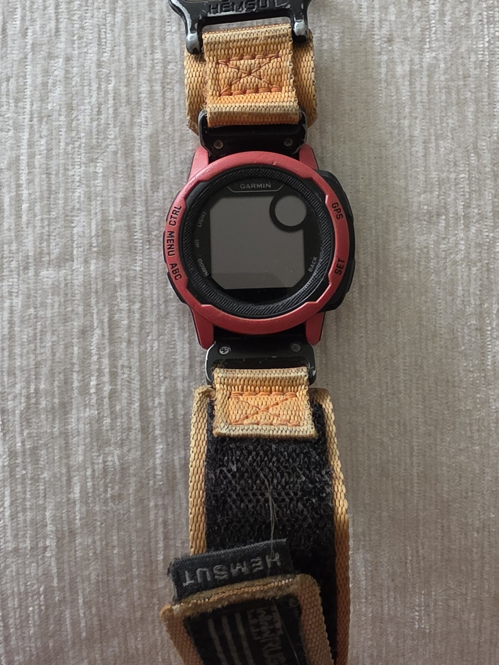 garmin red GPS sports watch with yellow nylon strap